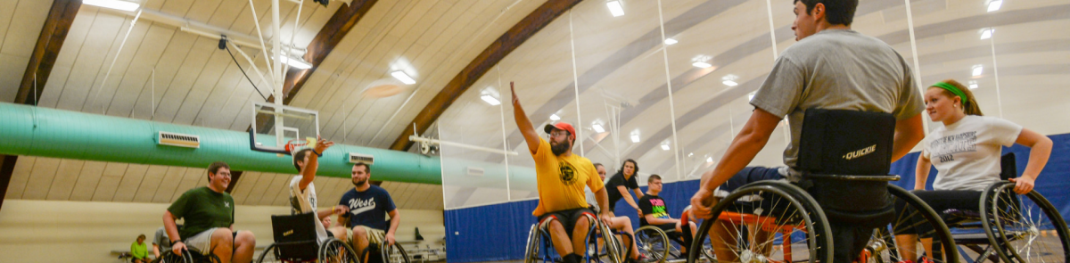Participants play wheelchair frisbee