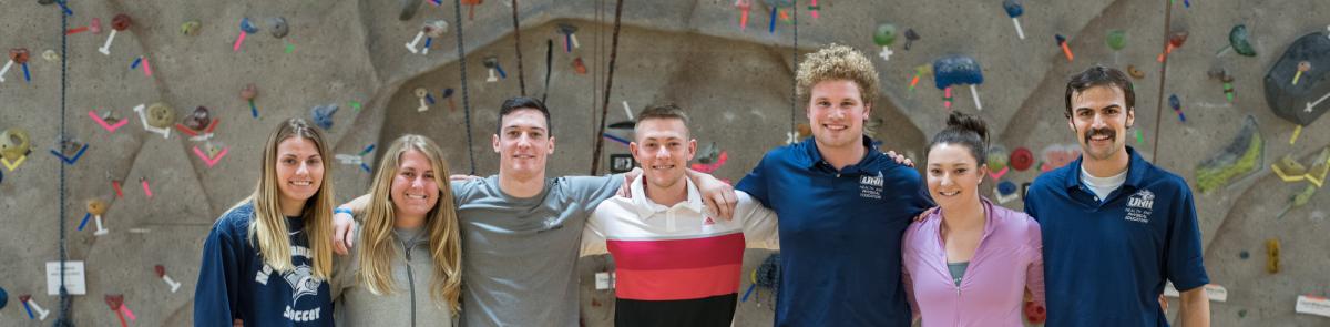 Health and Physical Education students in the climbing wall gym in NH Hall
