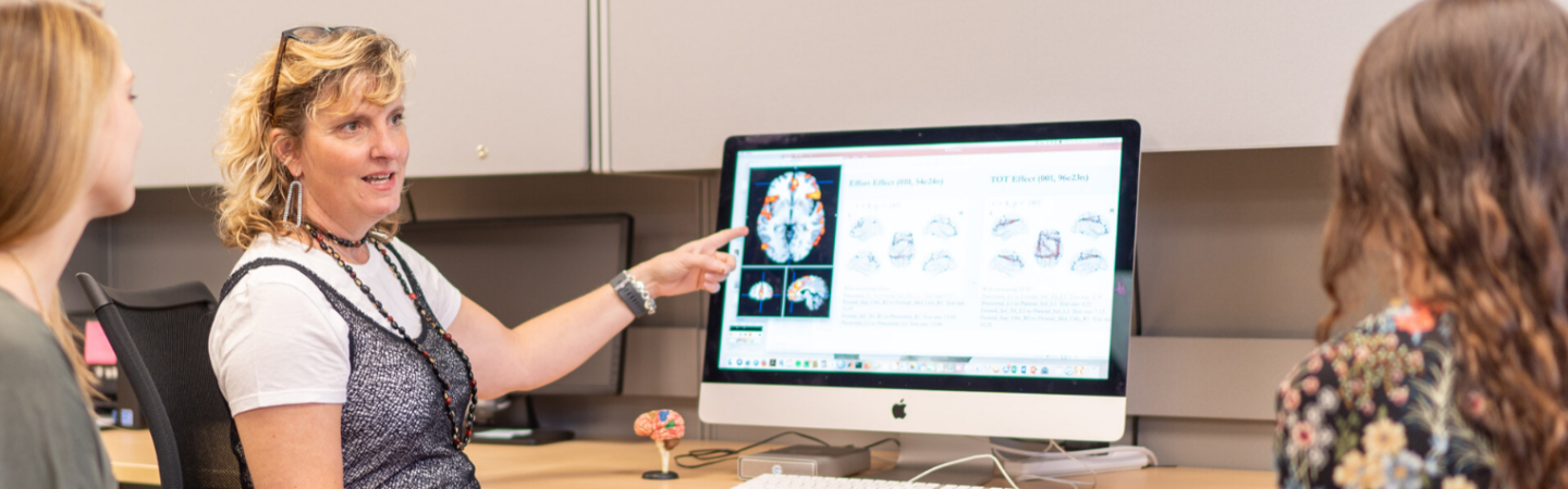 Professor Amy Ramage with CSD students in the neuroscience lab