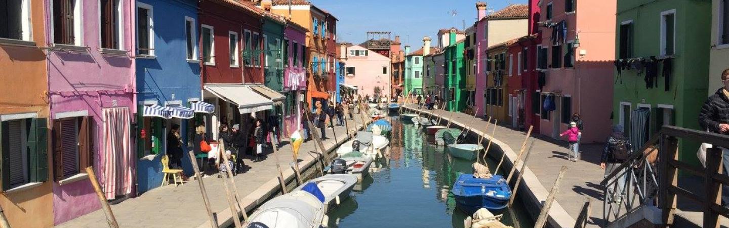 chhs study abroad colorful homes along canal in italy