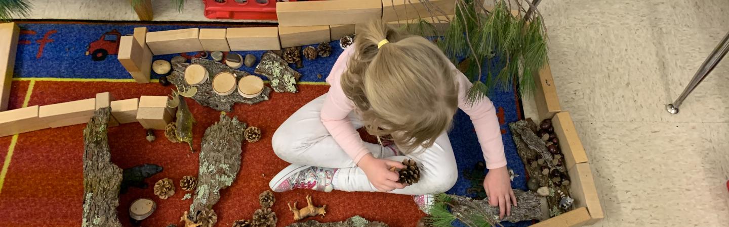 Child building with loose parts