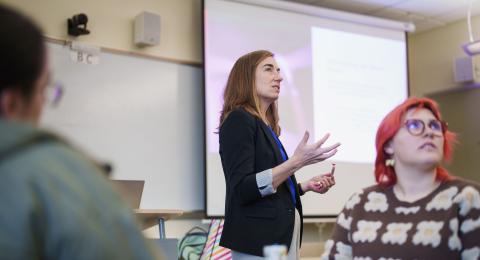 Meredith Young speaking in a classroom.