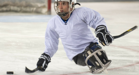 UNH Disability Studies student playing sled hockey