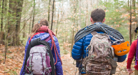 UNH Social Work and Recreation Management & Policy Dual Degree adventure therapy students hiking in the woods