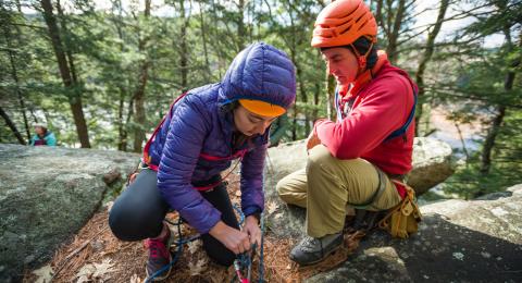 UNH students practicing tying ropes for rock climbing