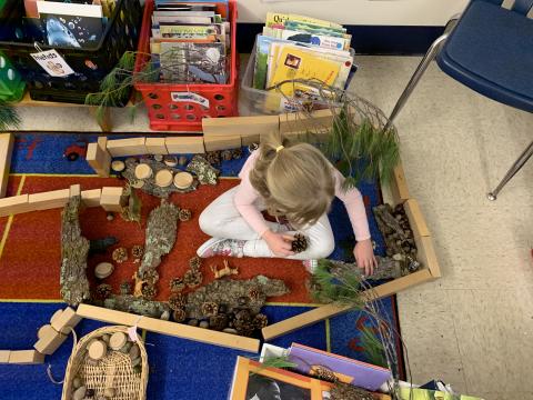 Child building with loose parts 