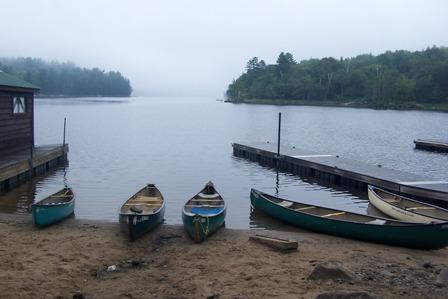 Lake, dock and canoes