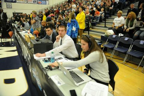 Students recording basketball game