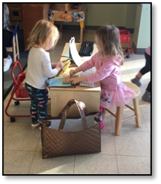 Two kids playing at a table