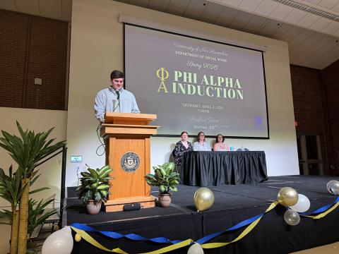 Member of Phi Alpha presenting