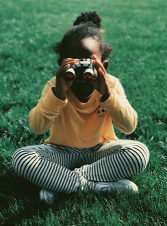 child using binoculars